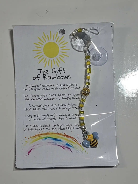 Small bee suncatcher featuring yellow and clear beads with a bee charm designed to brighten windows as suncatchers work best