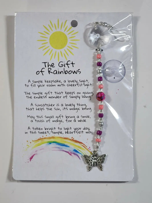Small butterfly suncatcher with a silver butterfly charm, colorful pink and purple beads, and a clear crystal top