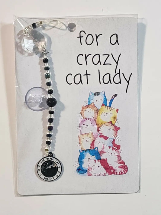 Small cat suncatcher featuring a black and clear beaded car sun visor charm with the black cat society pendant