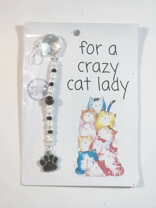 Small cat suncatcher with clear beads black and white beads and silver paw print pendant for car suction cup use