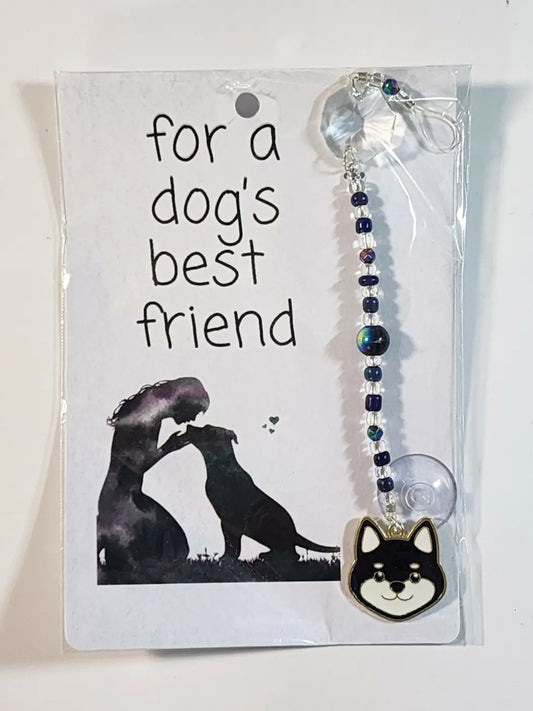 Small dog suncatcher featuring a black and white shiba inu face charm with beaded chain and suction cup for window display