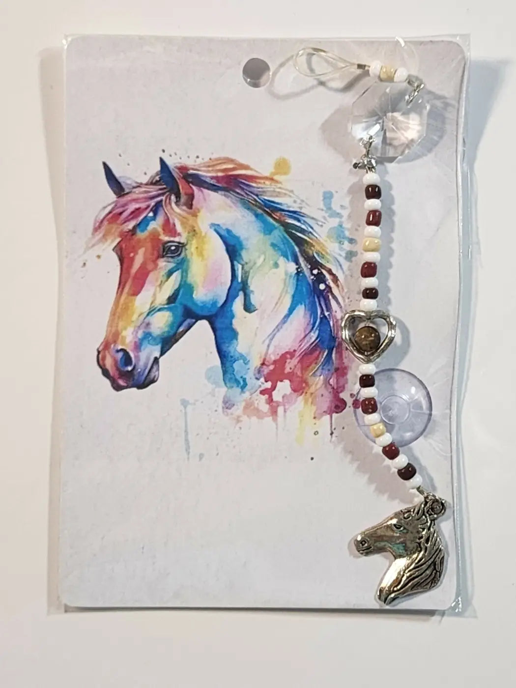 Small horse suncatcher featuring a silver horse head charm with crystal accents and a beaded chain for hanging
