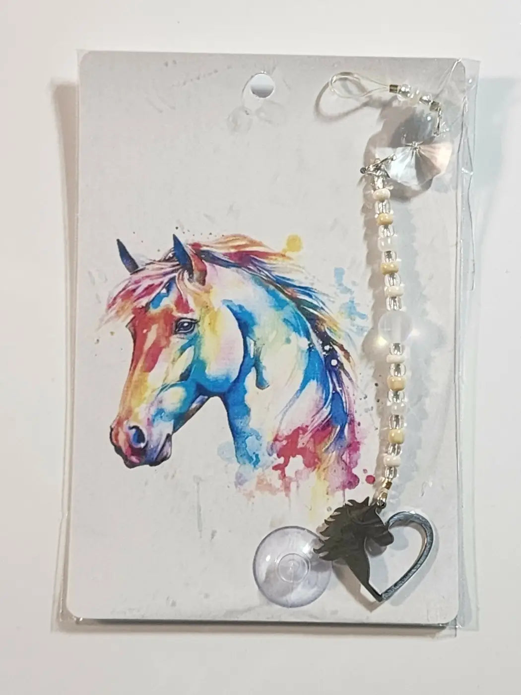 Colorful watercolor small horse suncatcher with silver heart pendant, beaded pearl and crystal chain, and clear suction cup attachment
