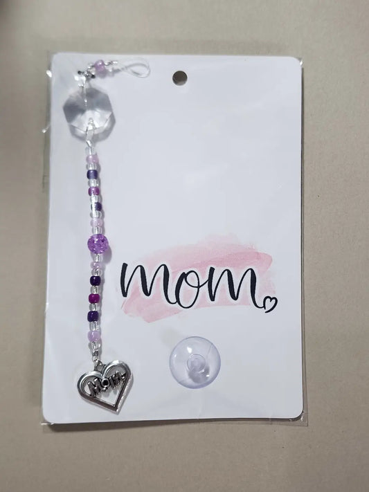 A small mom 14 charm with delicate purple and clear beads and a silver heart pendant, ideal for canadian made skincare gifts