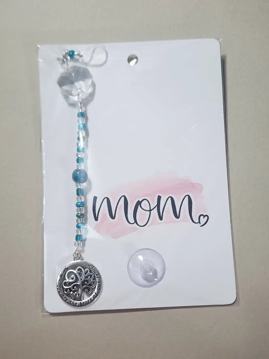 Small mom 2 silver tree of life pendant with engraved text on blue clear bead string topped by faceted crystal natural skincare canada