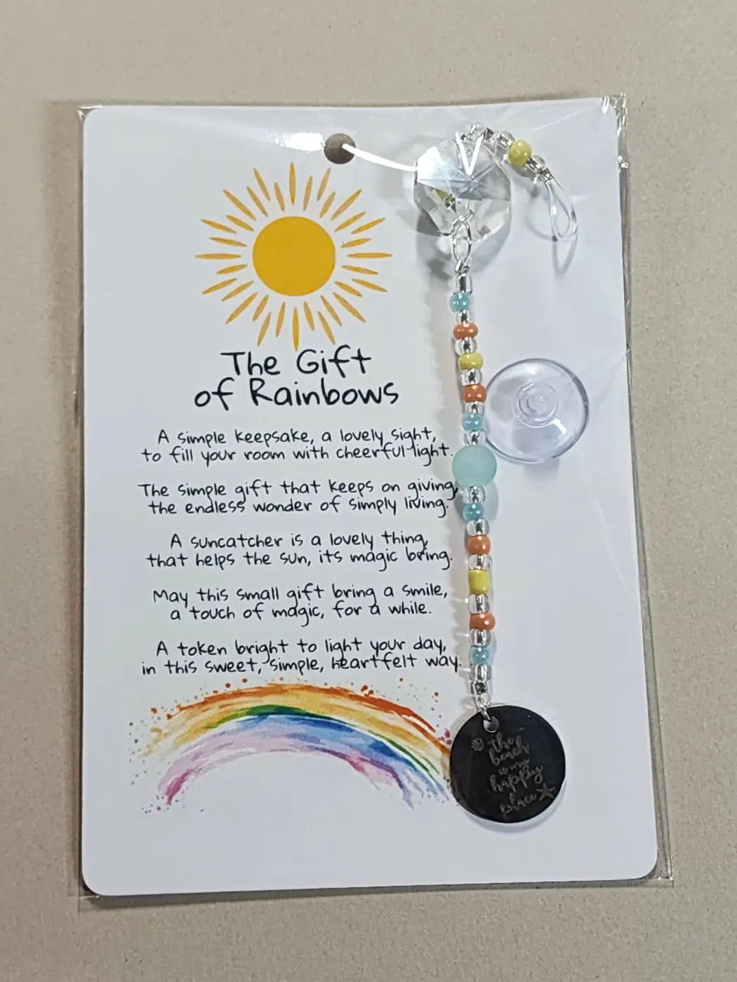 Small suncatcher featuring a clear faceted crystal with colorful beads and a black charm, perfect for canadian made skincare spaces