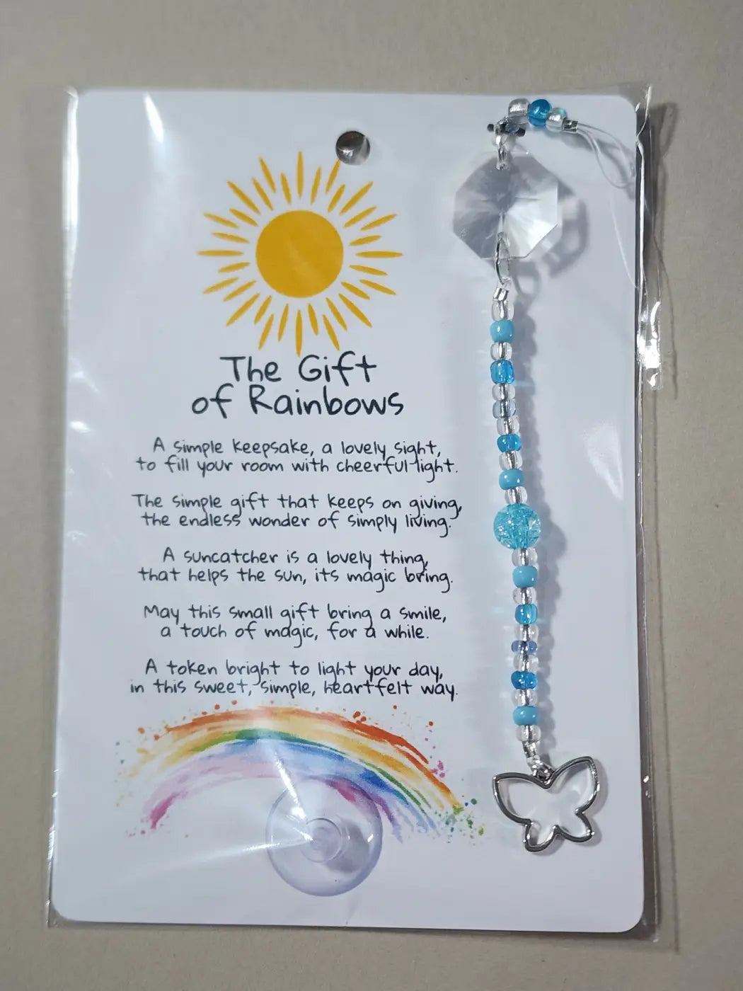 Small suncatcher with silver butterfly charm blue and clear beads and faceted crystal top canadian made skincare accessory