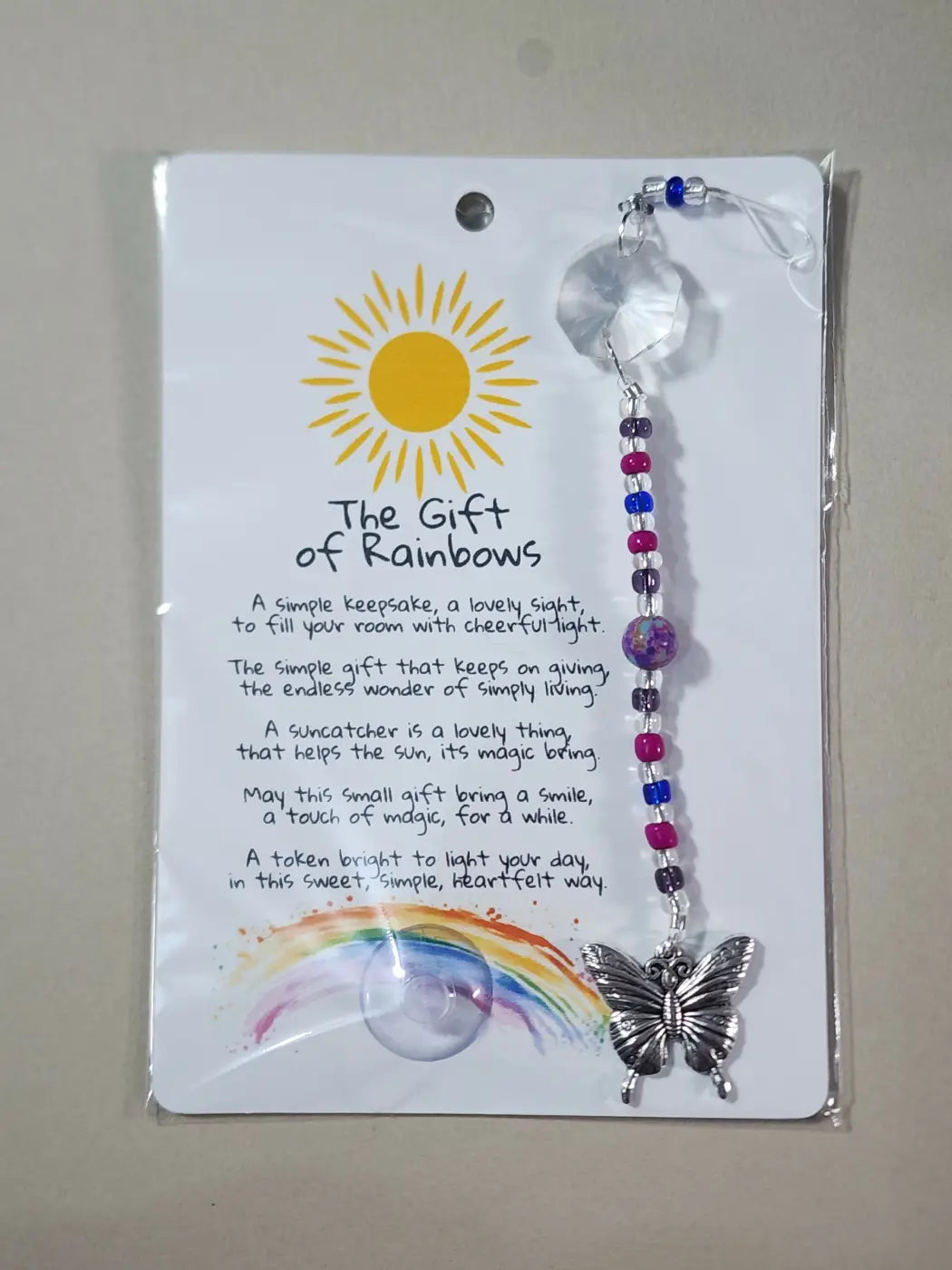 Small suncatcher silver butterfly with clear crystal top and colorful beaded chain for canadian made skincare decor