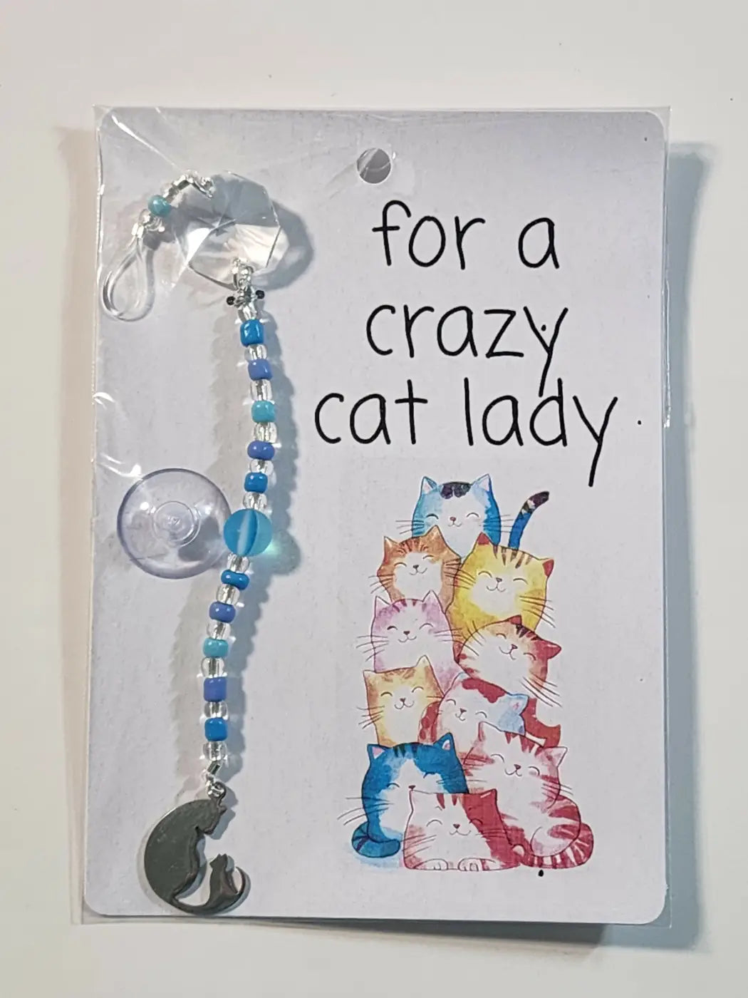 Small suncatcher blue and clear beaded cat-themed car window charm with silver-toned clip ideal for canadian made skincare gifts