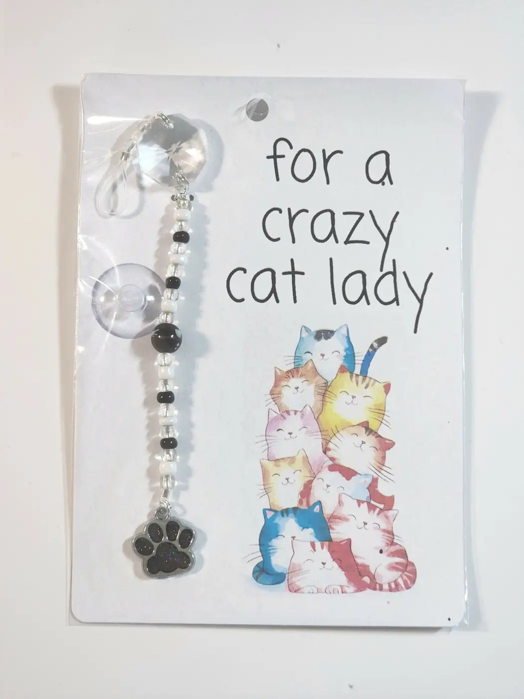 Small suncatcher black and clear beaded cat-themed suction cup charm with paw print pendant for canadian made skincare display