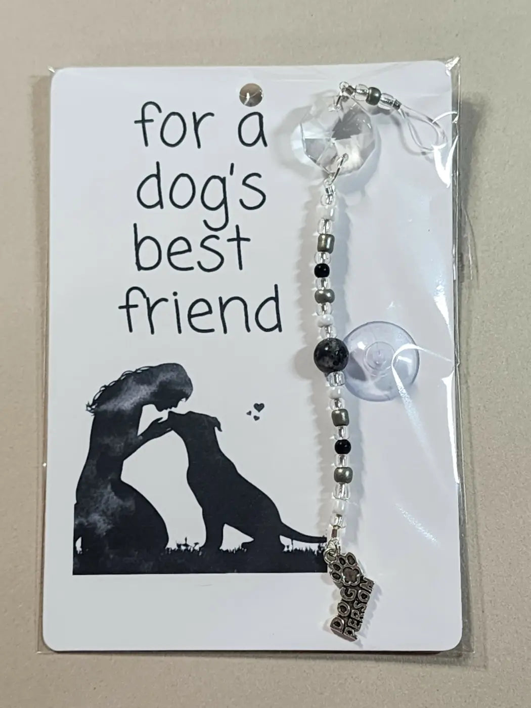 Small suncatcher silver-toned dog paw charm with clear crystal and black white beads on a beaded chain for canadian made skincare enthusiasts