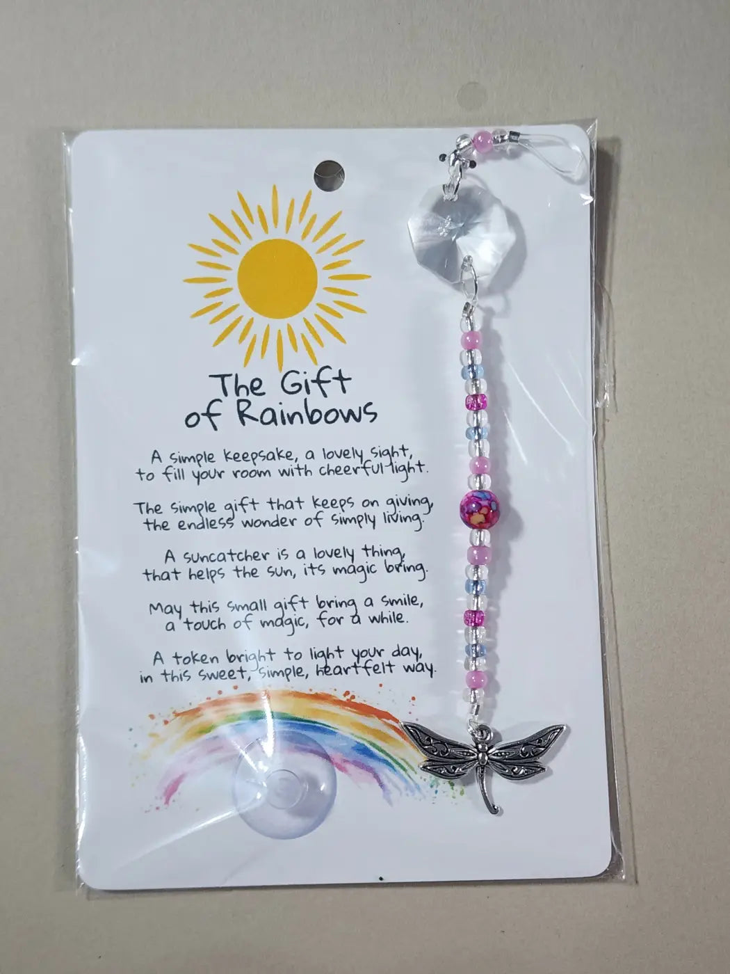 Small suncatcher with delicate pink and clear beads and a silver dragonfly charm, ideal for canadian made skincare spaces