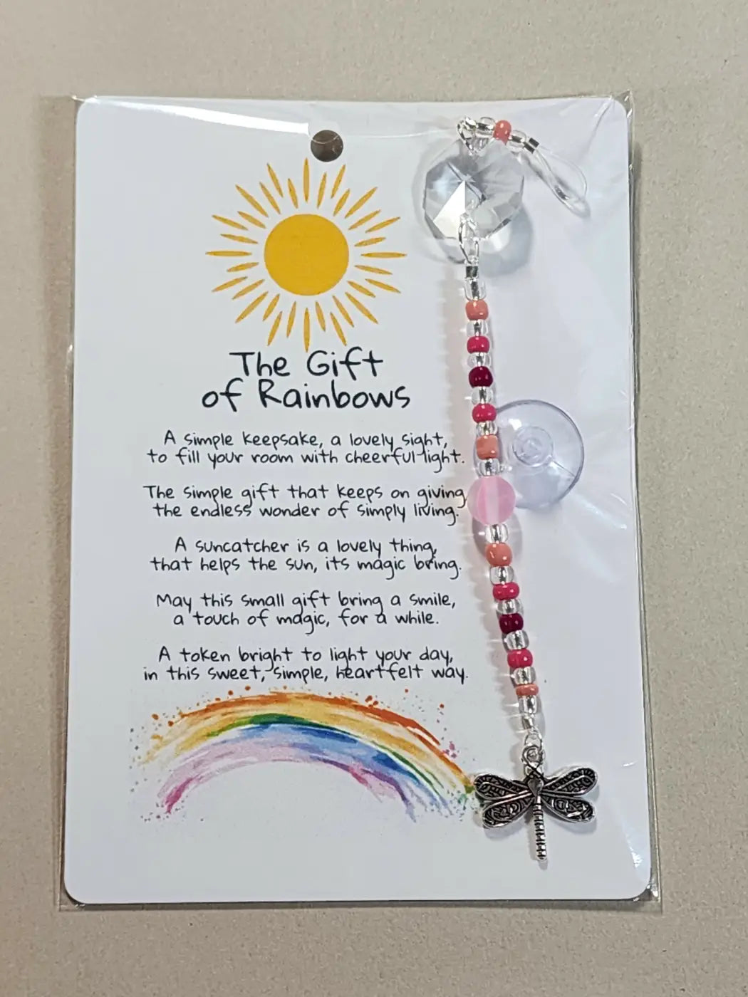 Small suncatcher with multi-colored beads clear crystal top and silver dragonfly charm reflecting canadian made skincare values