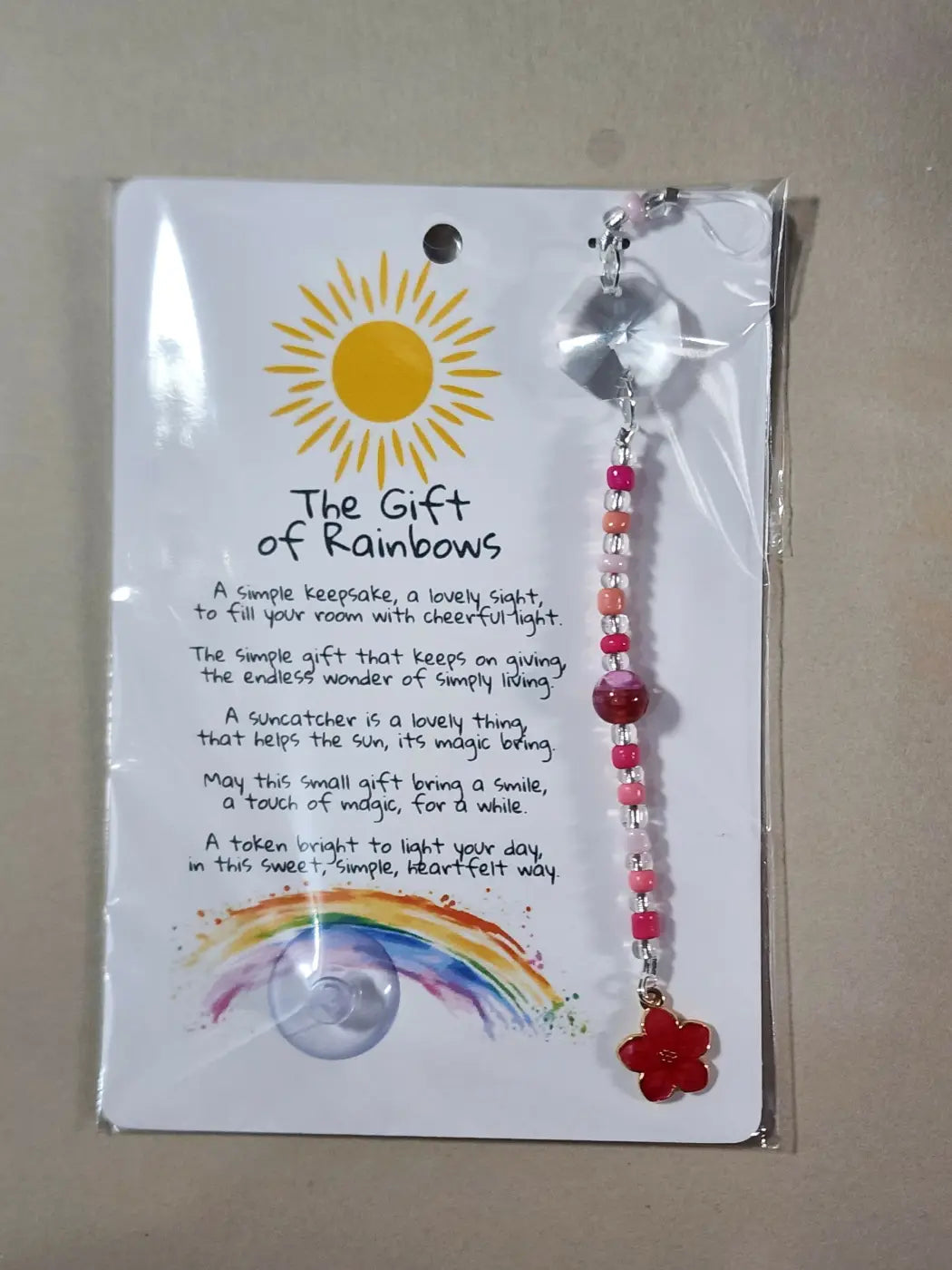 Small suncatcher with pink and red beads, clear crystal top, silver chain, and red flower charm for canadian made skincare decor