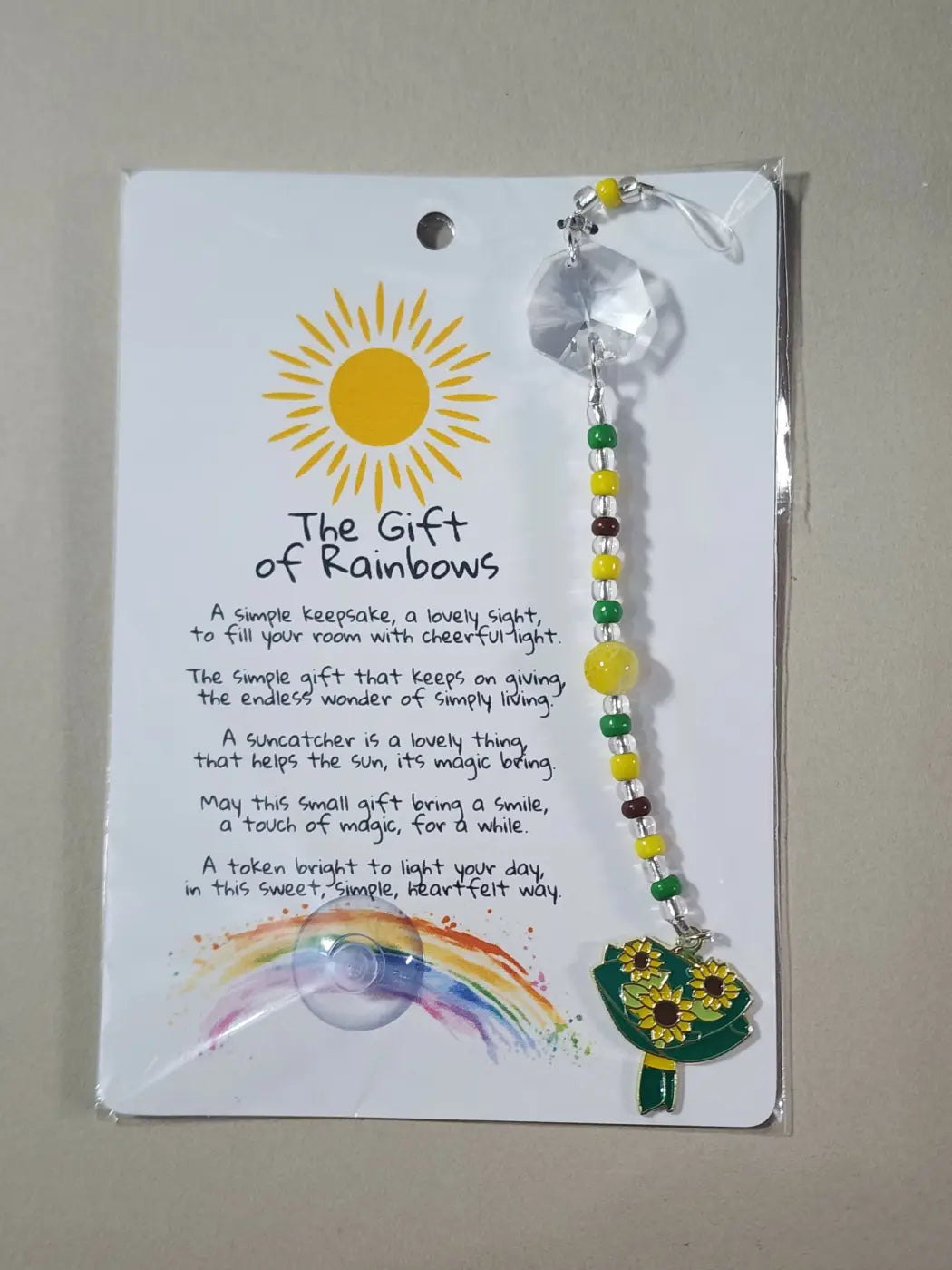 Small suncatcher featuring sunflower-themed design with clear faceted top and yellow green beaded chain for canadian made skincare decor