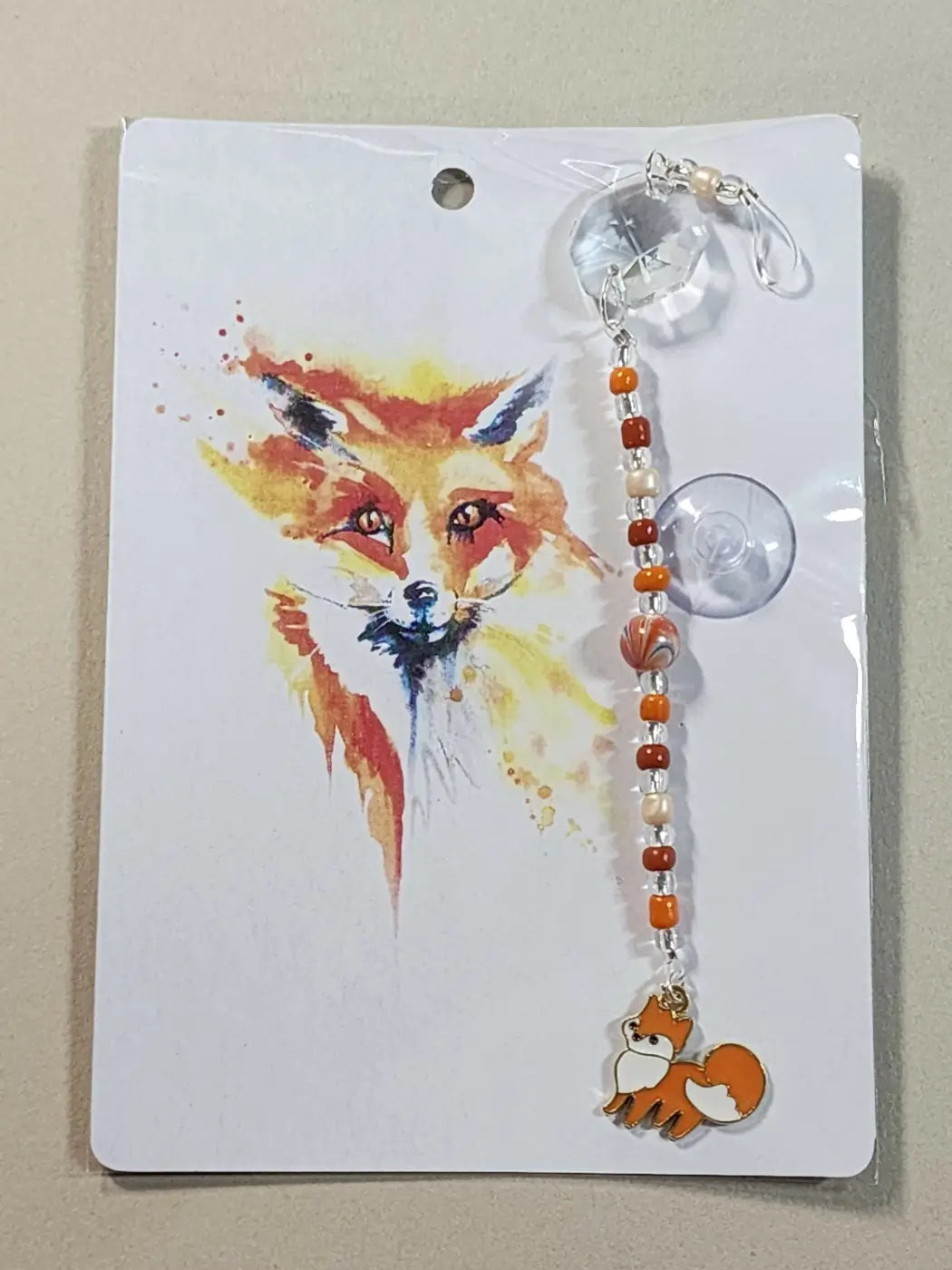 Small suncatcher featuring a charming orange and white fox-themed beaded keychain with a clear crystal charm, ideal for canadian made skincare gifts