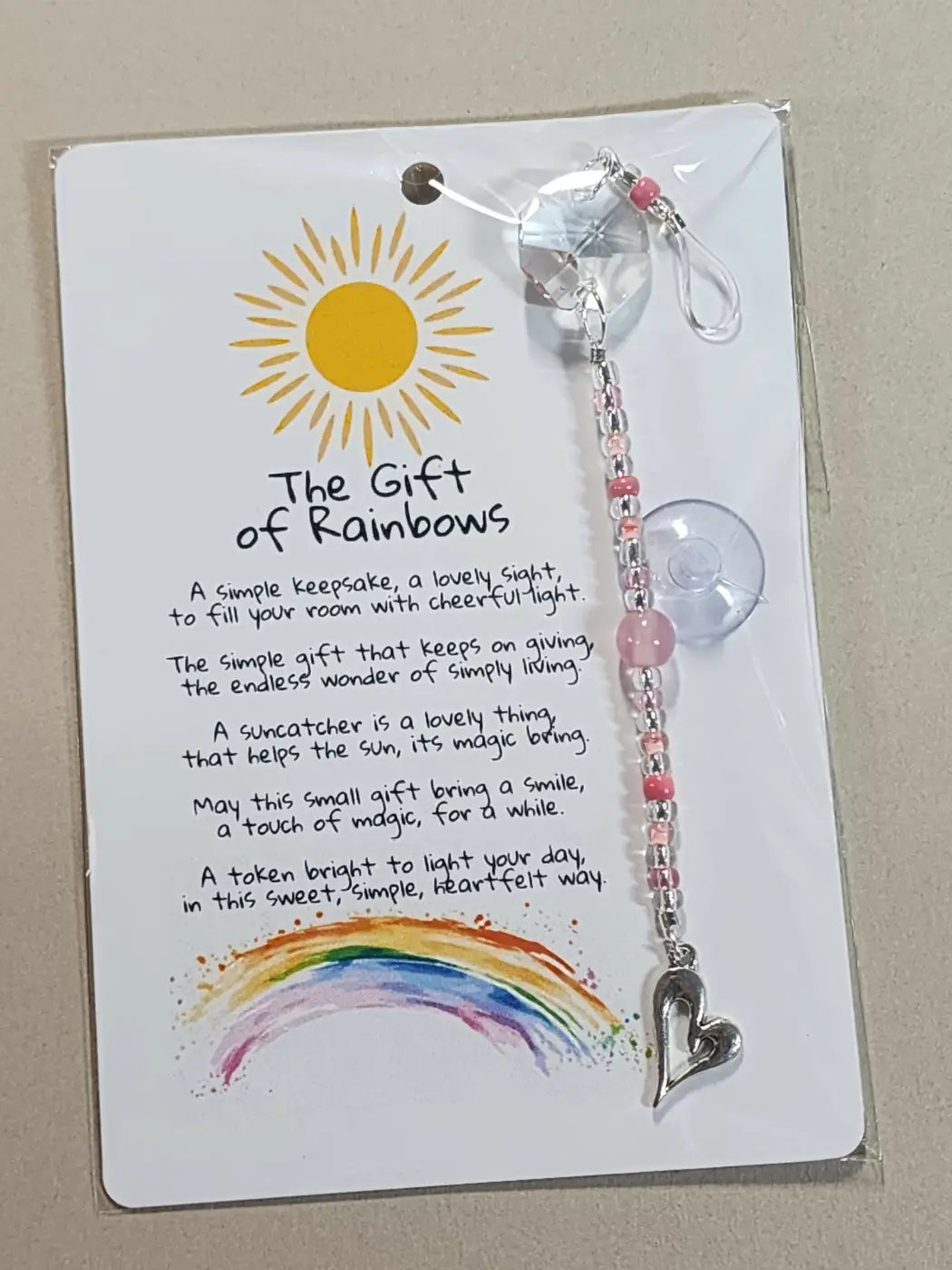 Small suncatcher featuring a delicate silver heart charm and pink crystal beads, ideal for handmade soap canada gift decor