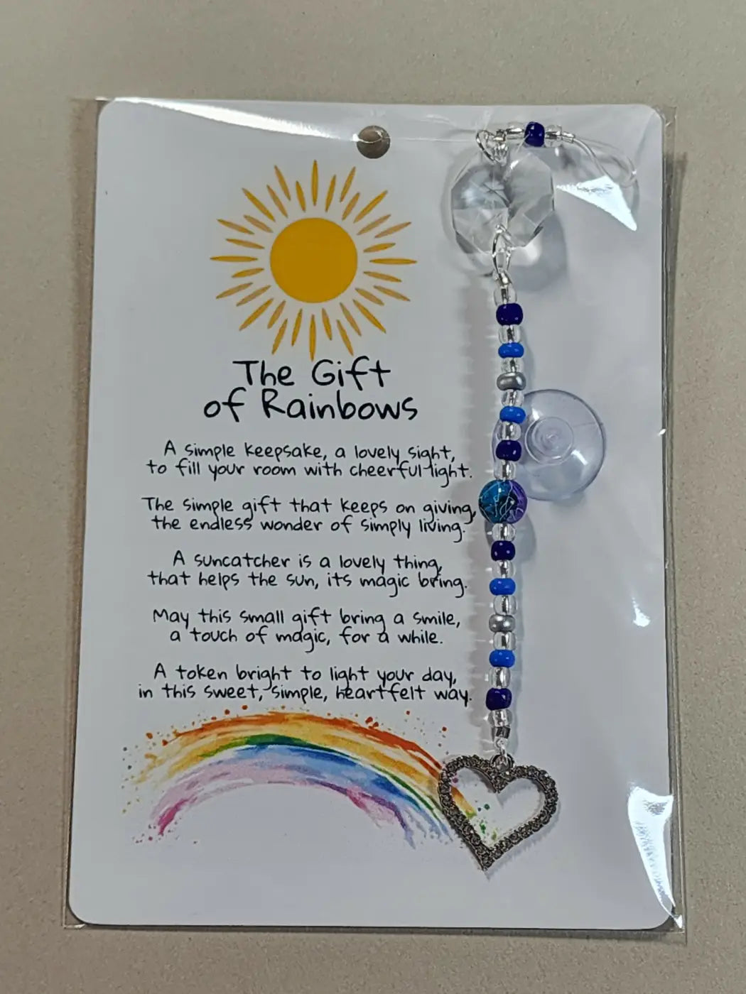 Small suncatcher heart-shaped with silver-toned glitter finish hanging from blue and clear bead chain canadian made skincare accessory