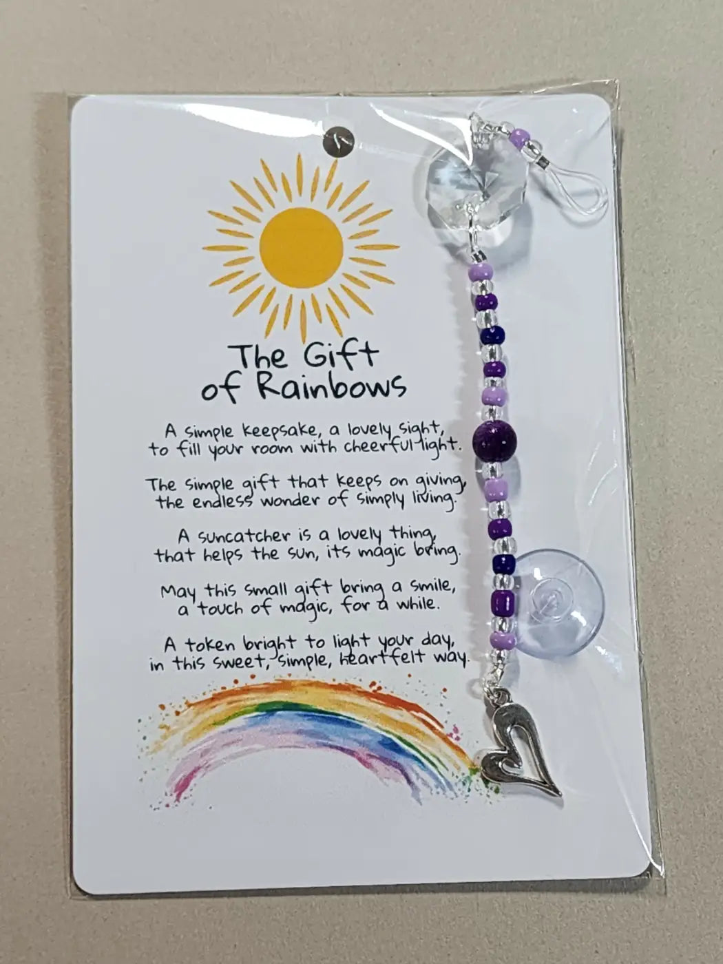 Small suncatcher with purple beads clear crystal top silver heart charm and suction cup base suitable for canadian made skincare settings