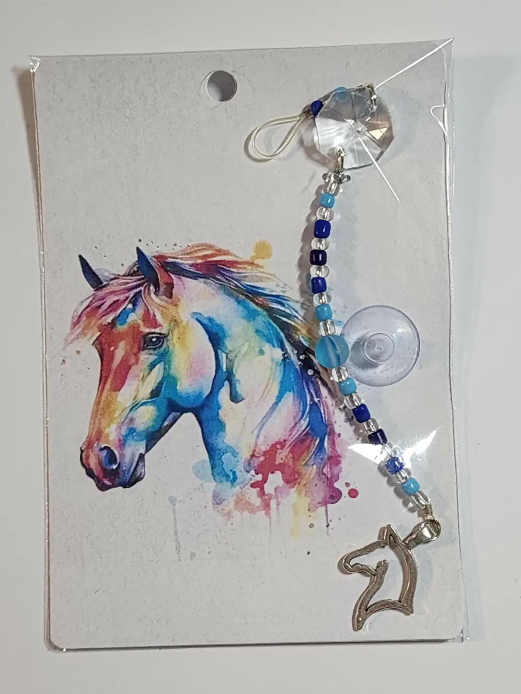 Small suncatcher with colorful watercolor horse illustration and blue silver beaded carabiner charm canadian made skincare