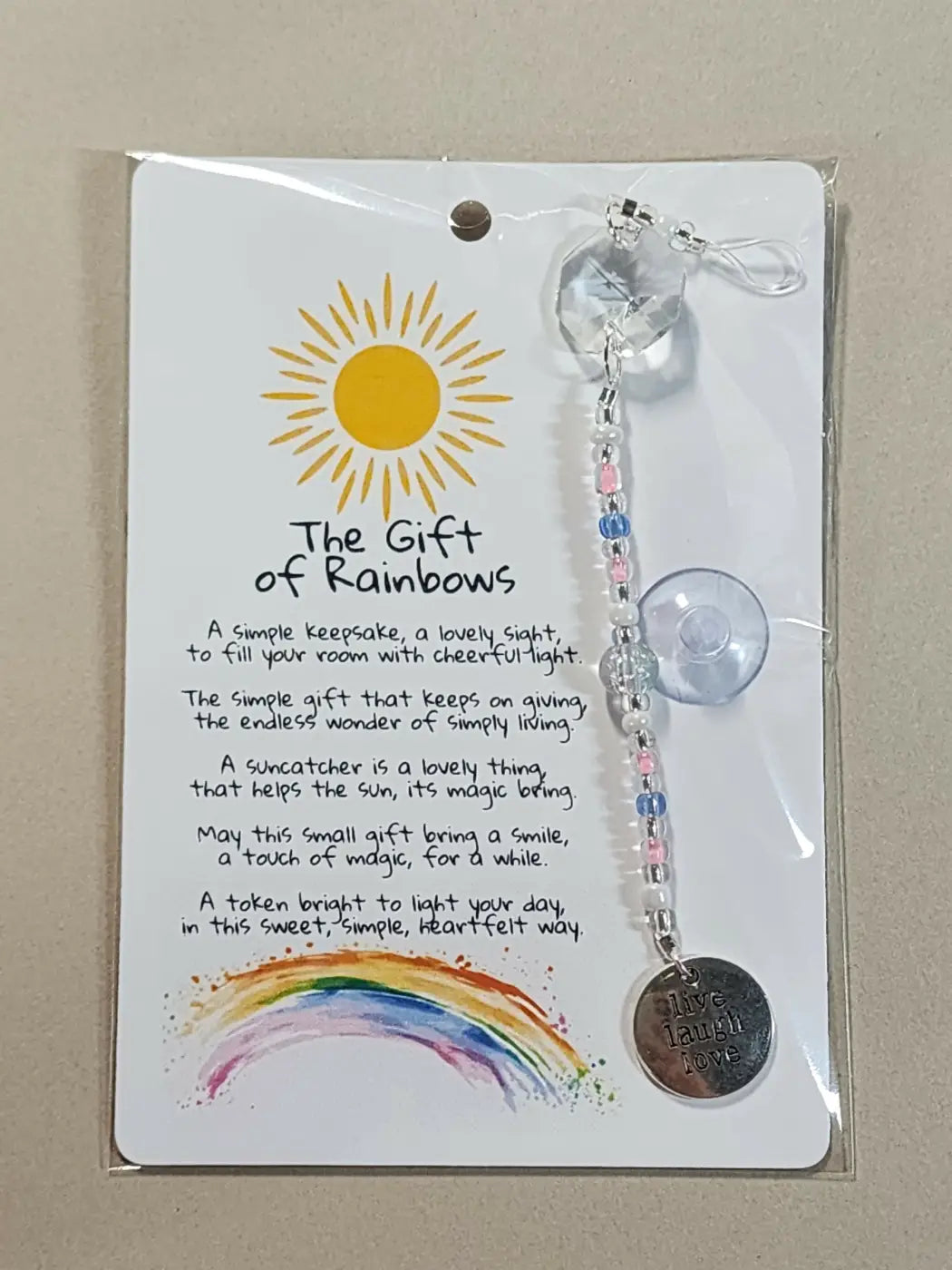 Small suncatcher with clear faceted crystal, silver chain, colorful beads, and live laugh love charm, natural skincare canada accessory