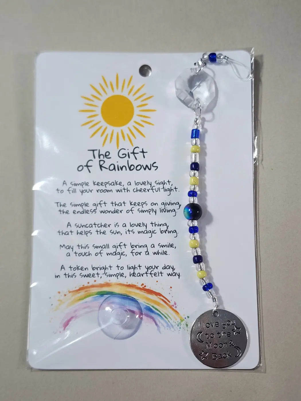 Small suncatcher pendant silver tone with engraved stars on beaded chain featuring blue yellow clear crystals canadian made skincare
