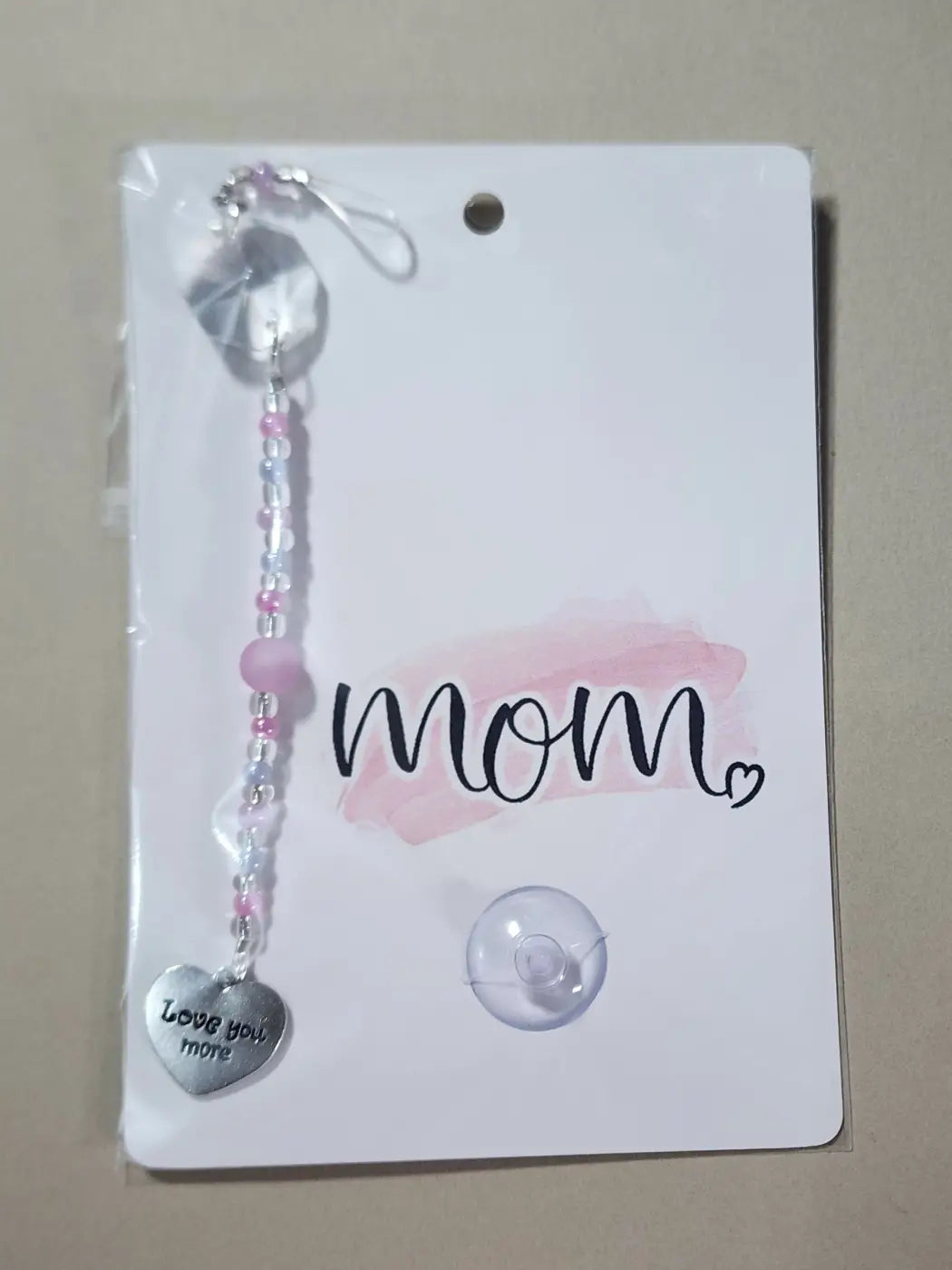 Small suncatcher featuring a delicate pink and clear beaded charm with a silver heart pendant natural skincare canada