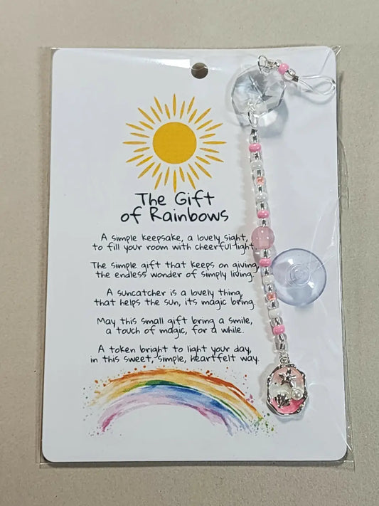 Small suncatcher with pink and clear beads, crystal charm, star pendant, and suction cup for direct sunlight display
