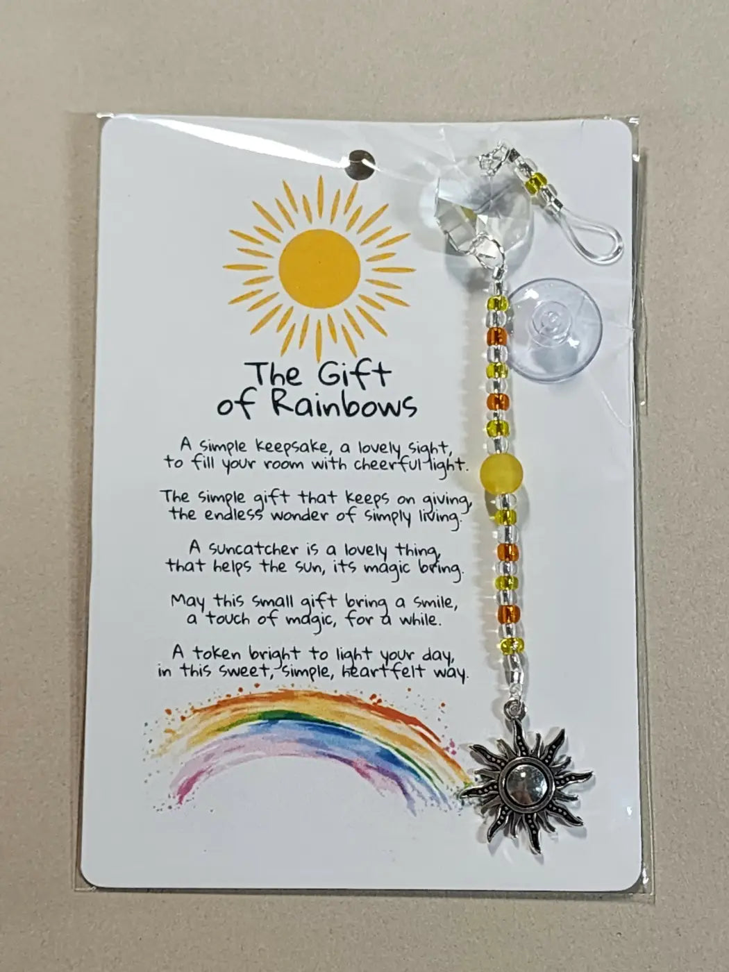 Small suncatcher with silver sun shape, clear crystal top, colorful beads, canadian made skincare gift of rainbows packaging