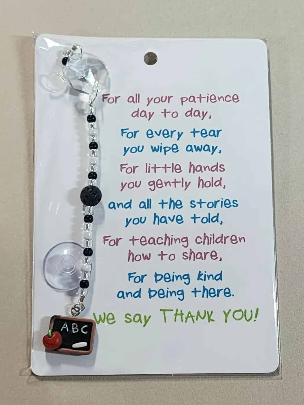 Small suncatcher clear beaded car phone holder with black and white bead chain and crystal charm, ideal for natural skincare canada fans