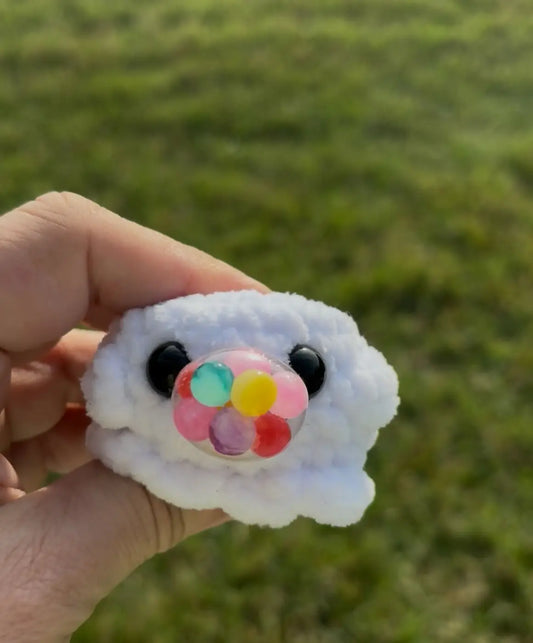 White crocheted cloud-shaped squishy ghost fidget toy with black bead eyes and colorful gel bead dome, handmade soap canada