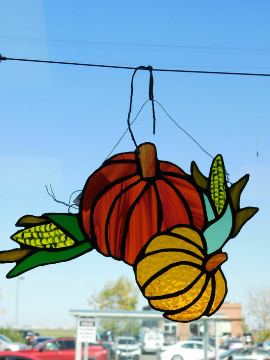 stained glass suncatcher - displays traditional fall vegetation, highlighted by the bright orange pumpkin w hand painted corn stocks, a full 10in x 6 in - Pure Wash Canadian Made - Winnipeg
