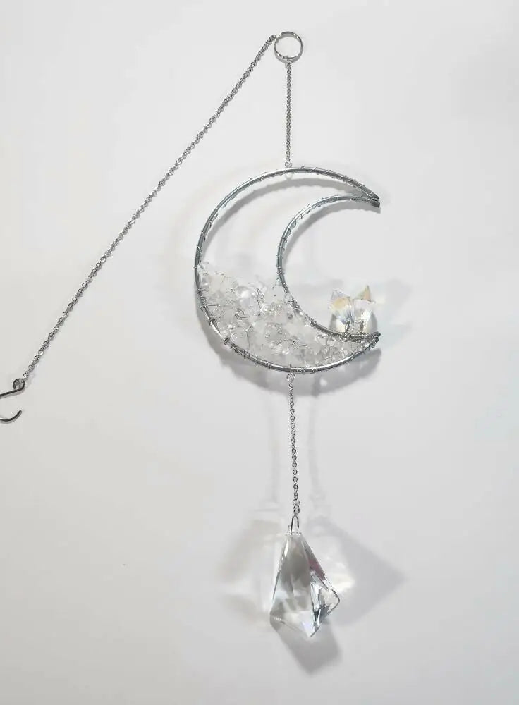 Crescent stone suncatcher with clear crystals, a faceted pendant and a suction cup