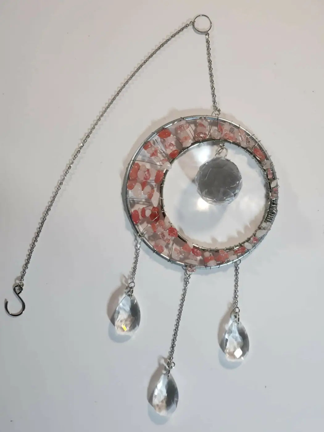 Stone suncatcher with inch metal hoop featuring pink and clear crystal fragments and dangling teardrop crystals with suction cup