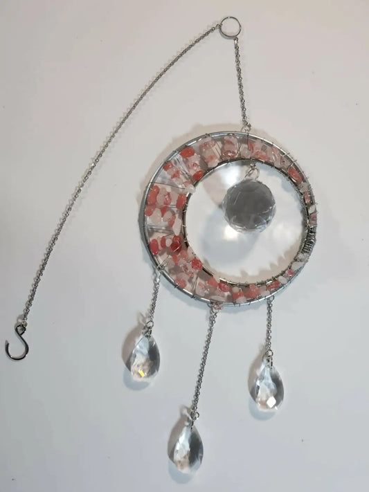 Stone suncatcher with inch metal hoop featuring pink and clear crystal fragments and dangling teardrop crystals with suction cup