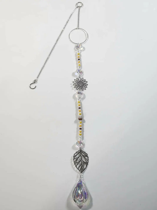 Silver-toned sunflower long suncatcher with clear crystal beads yellow accents and a dangling teardrop prism iridescent ornament