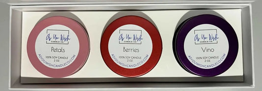 Three handmade soy candles in pink red and purple containers from as you wish candle co amour collection