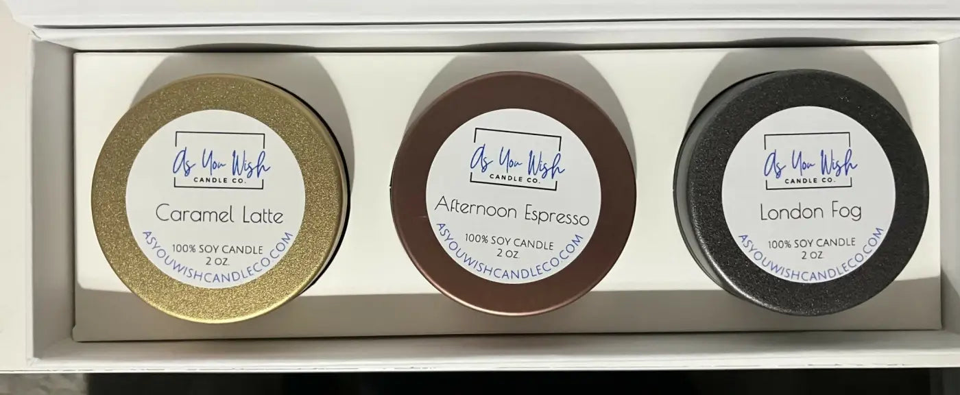 Three round 2 oz soy candles in metallic gold brown and black tins from as you wish candle co barista collection