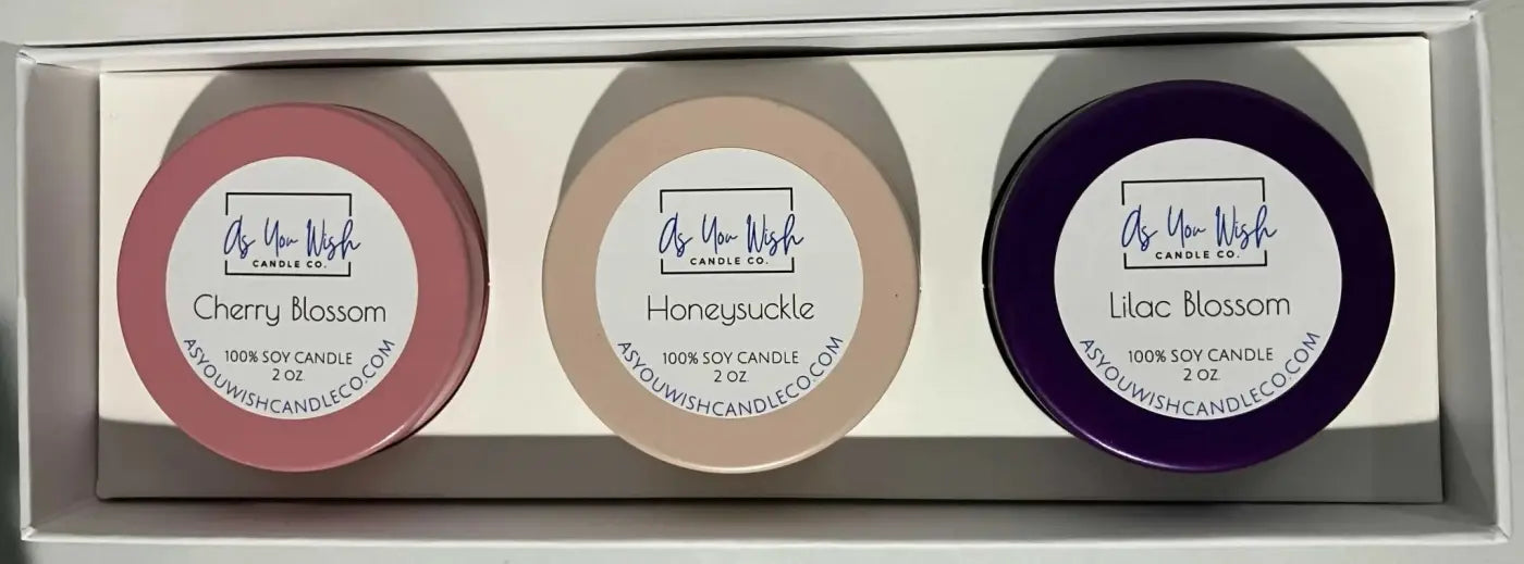 Three round handmade soy candles in bloom collection gift box in cherry blossom pink honeysuckle beige and lilac purple