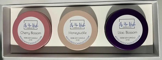 Three round handmade soy candles in bloom collection gift box in cherry blossom pink honeysuckle beige and lilac purple