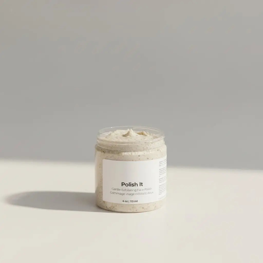 A clear glass jar with a light beige textured facial exfoliant labeled polish it from the it line skincare bundle
