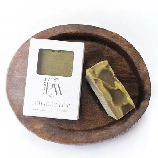 Tobacco Leaf Soap Bar with refreshing sweet fragrance on wooden tray.
