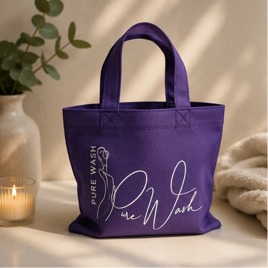 Purple canvas reusable tote bag with white pure wash branding and stylized silhouette for soap bundle use