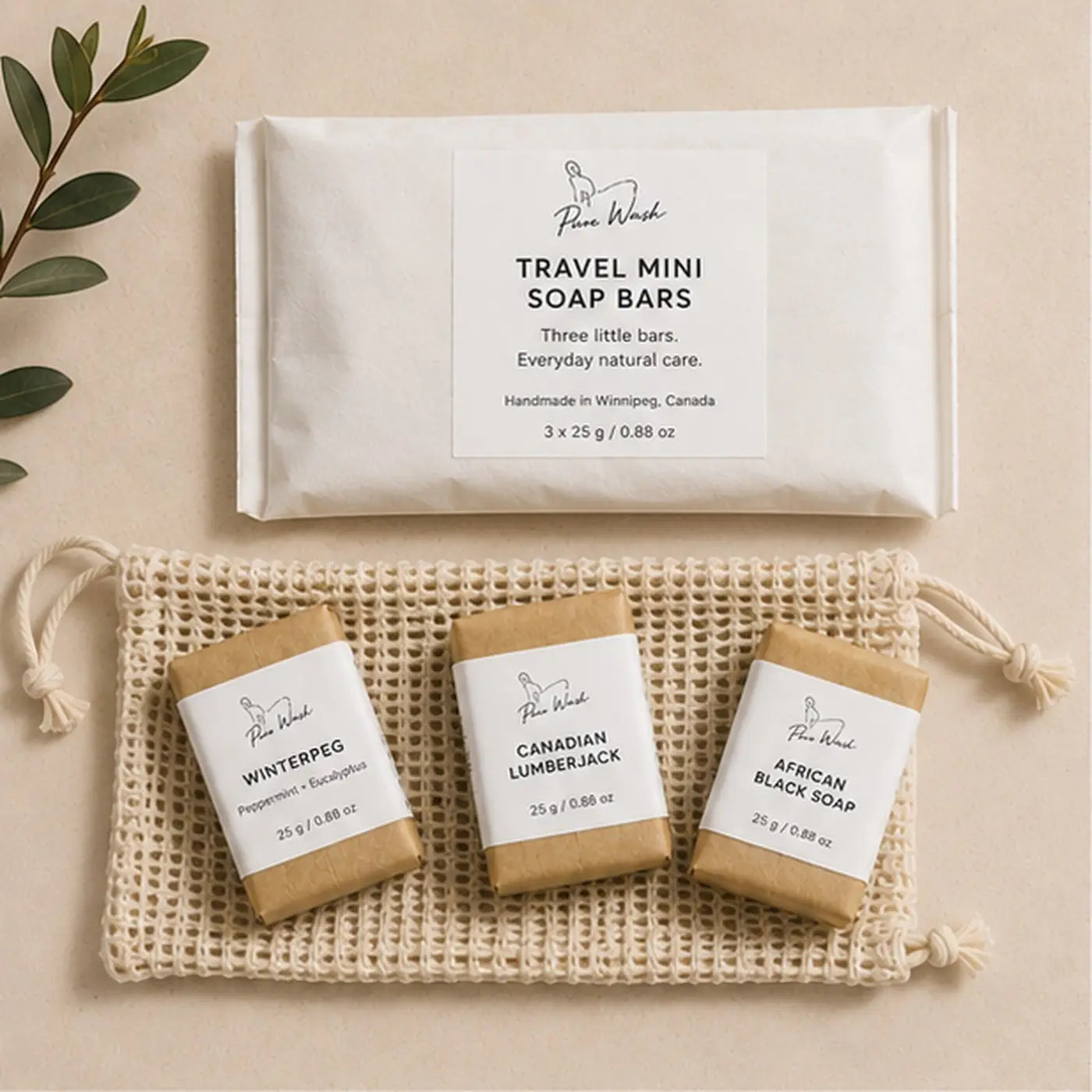 Three pure wash travel mini soap bars in distinct scents wrapped in beige mesh pouch for easy travel use