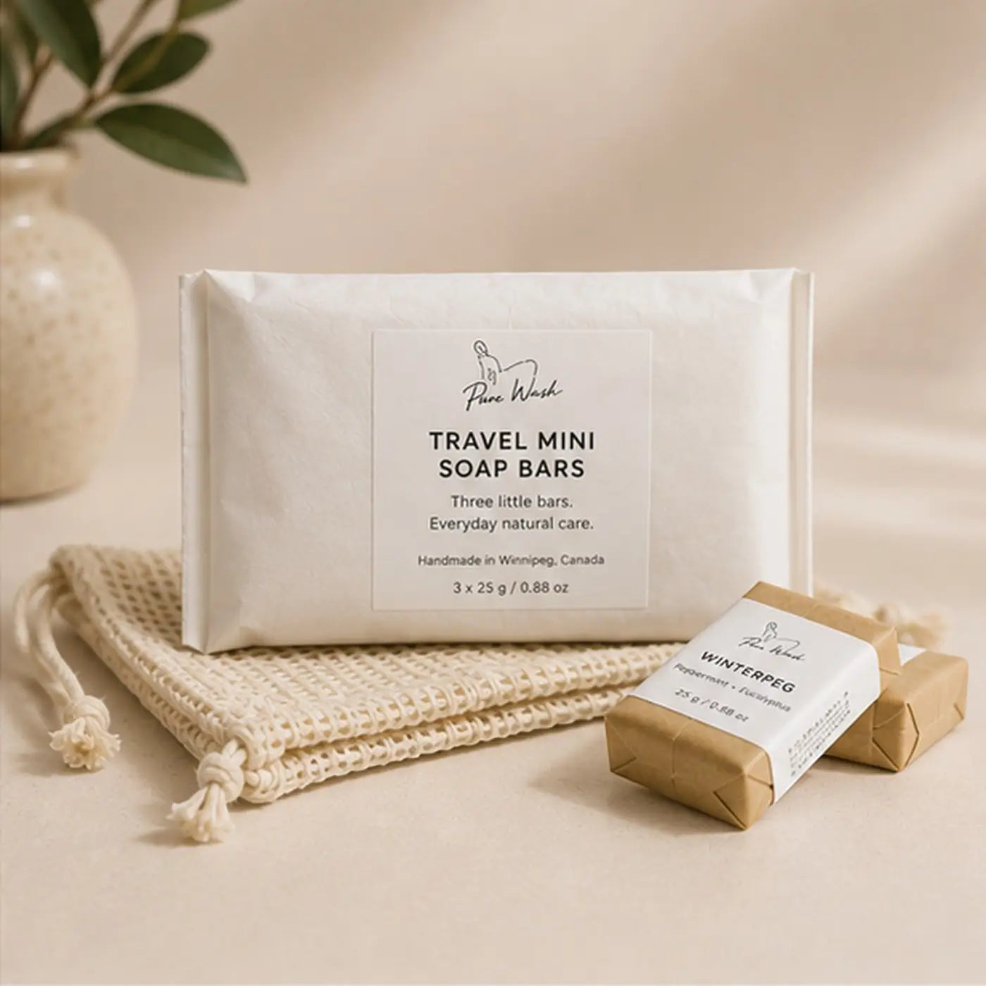 White packaged pure wash travel mini soap bars featuring three 25g natural brown paper wrapped mini soap bars