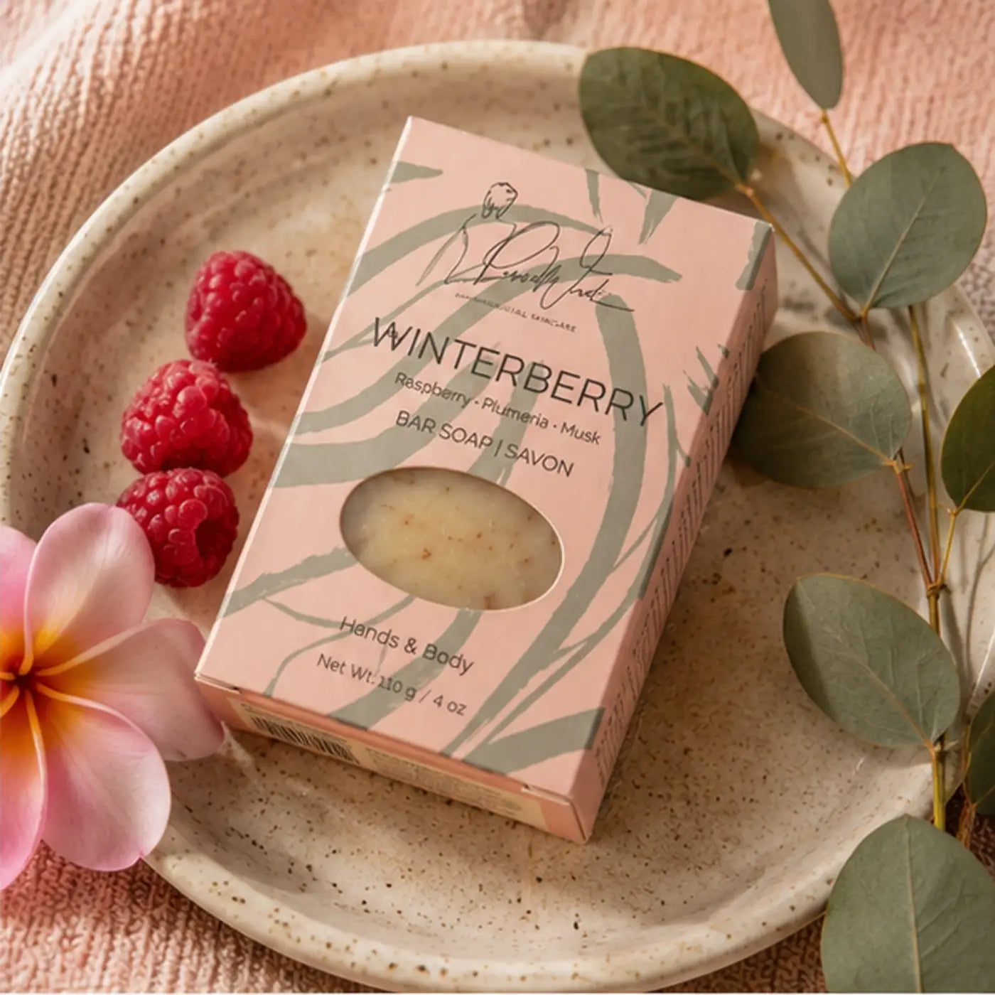 Winterberry soap bar by Beverly Hale in pink and green patterned box with clear window showing handmade soap supports healthy skin