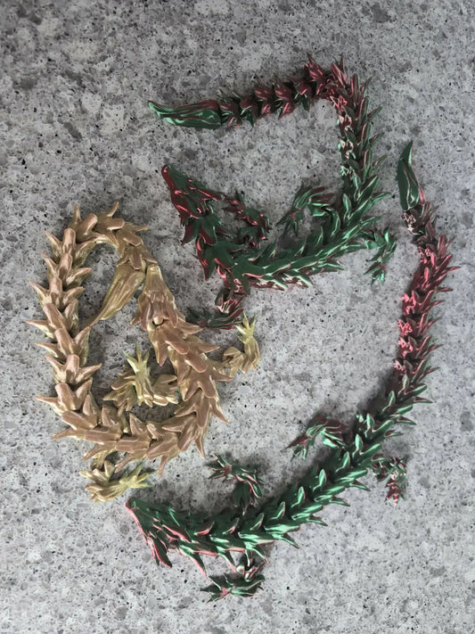 Xl dragon handcrafted gold and green dragon-shaped chains showcasing canadian made skincare inspired design