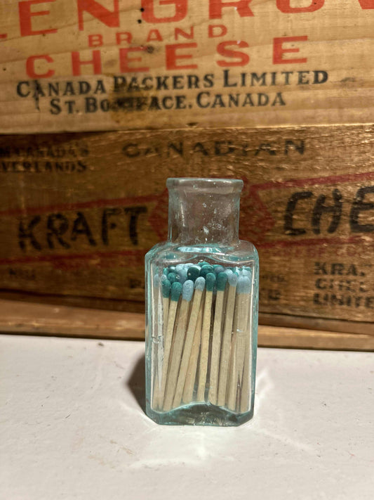 Small Antique Aqua BottleMatch VesselSmall Antique Aqua Bottle mudlarked from one of the rivers in Manitoba, now repurposed as a match vessel! Filled with colored matches made of aspen wood, hand crafteSmall Antique Aqua BottleCG Pure Wash