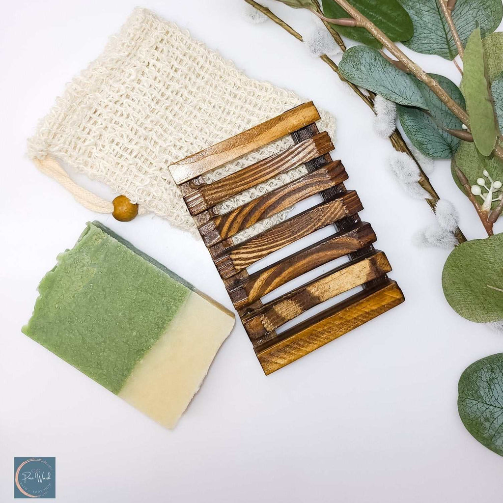 Soap Saver Bags with eco-friendly materials, green soap bar, and wooden soap holder on a white background.