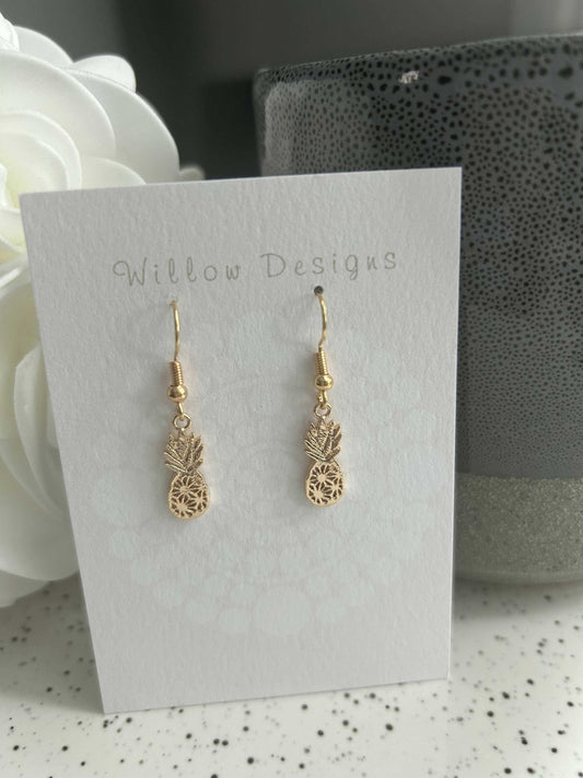 Gold Pineapple Dangly EarringsJewelryThese pineapple dangly earrings are just the cutest! 
-14K gold plated-nickel free -hypoallergenic Gold Pineapple Dangly EarringsCG Pure Wash